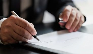 Signing a document with a pen